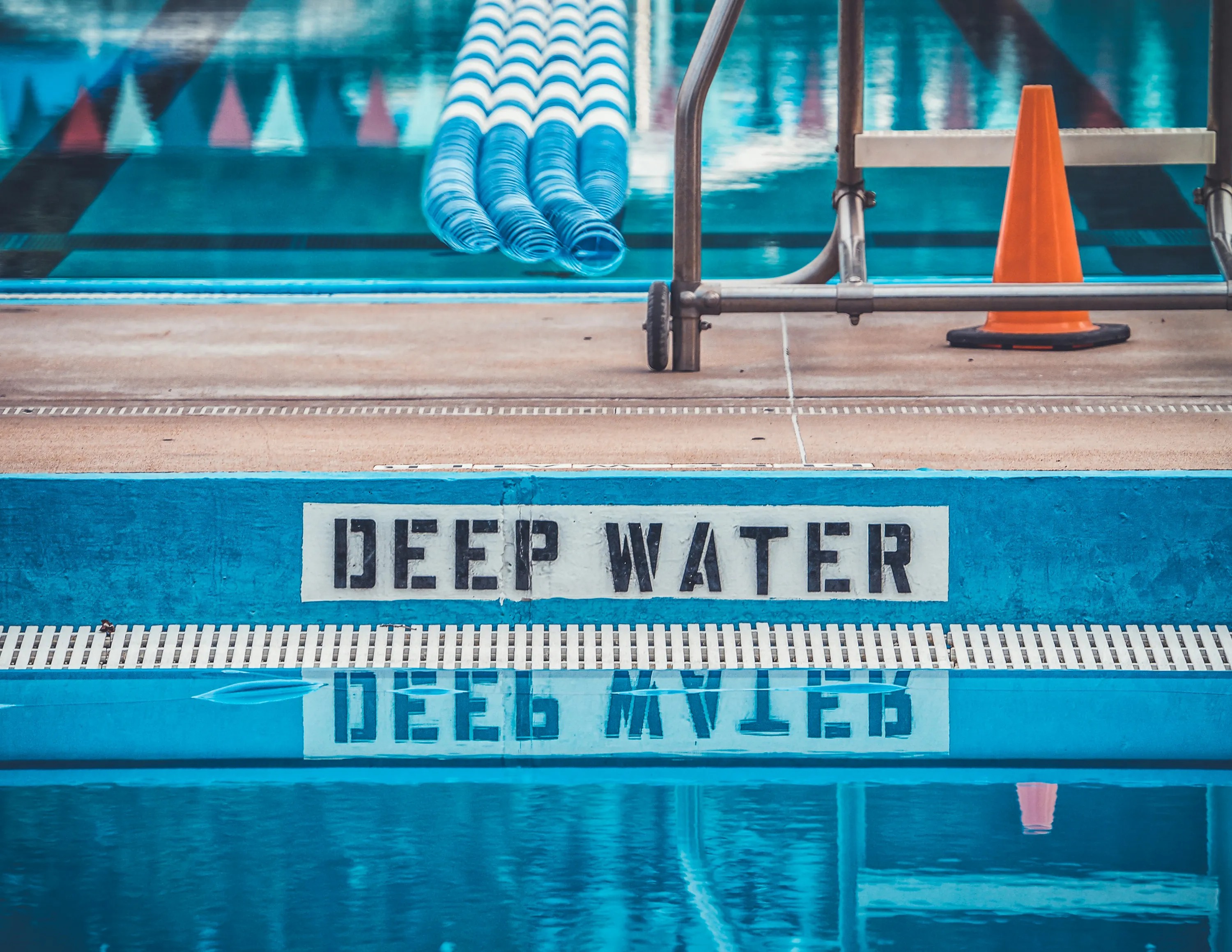 Swimming pool with a Deep Water sign.